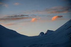 14 The First Light Of Sunrise Burns The Scattered Clouds Orange Above The Raphu La And Chomolonzo From Mount Everest North Face Advanced Base Camp 6400m In Tibet.jpg